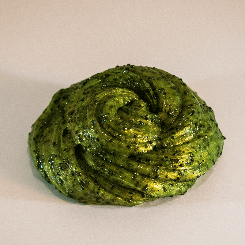 clear slime is heavily textured with black silica sand