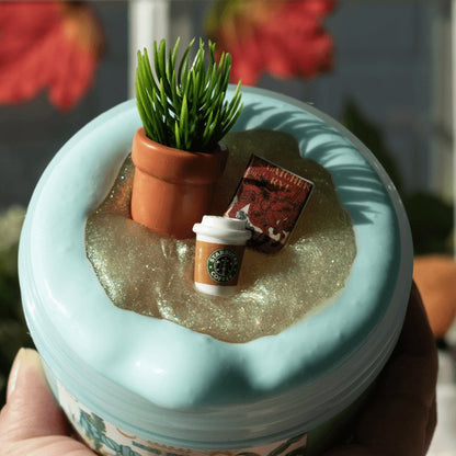 Teal colored Thicc Boi base and a 2oz gold clear slime topper.