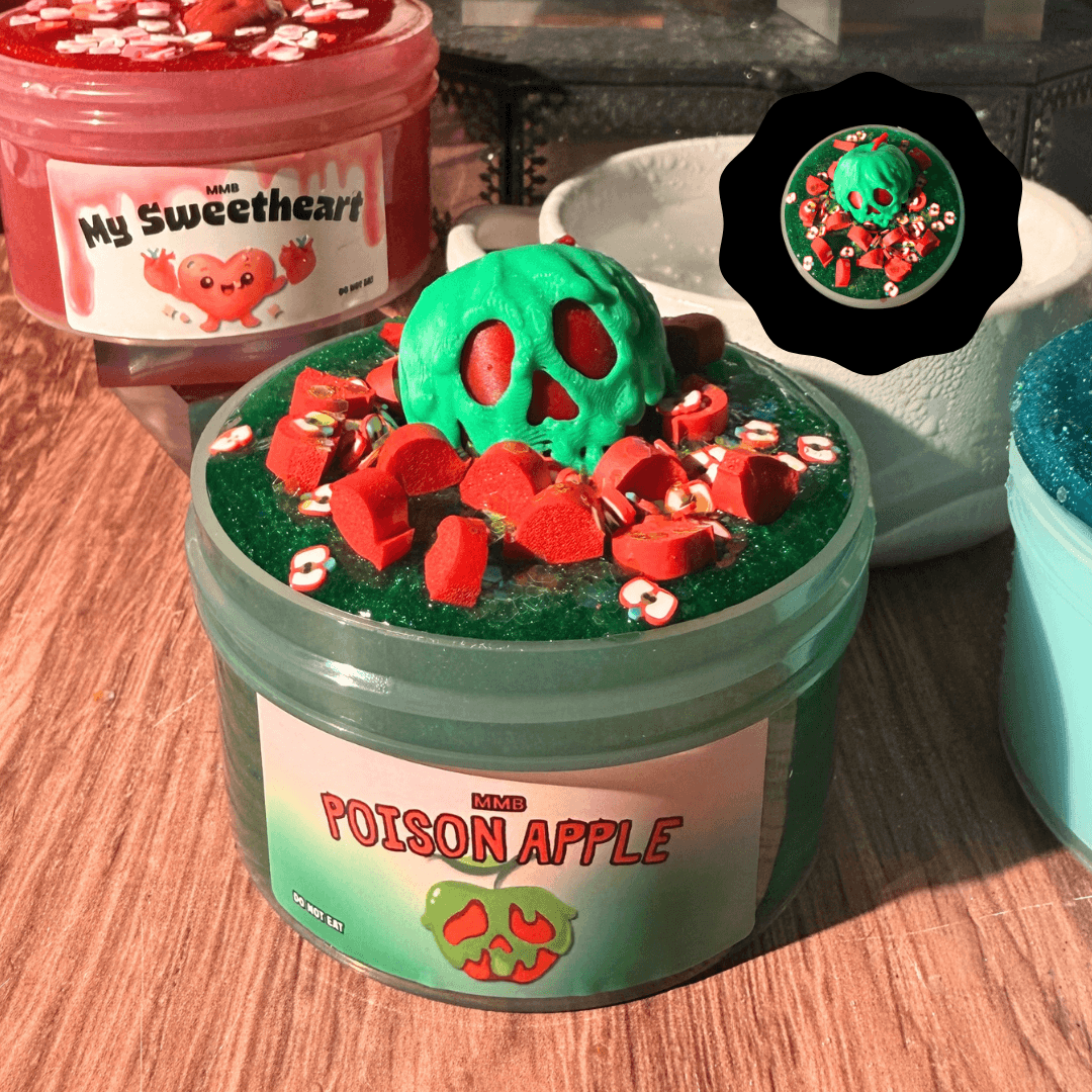 poison apple halloween slime jar topped with red java chips, apple fimo, and green poison apple charm