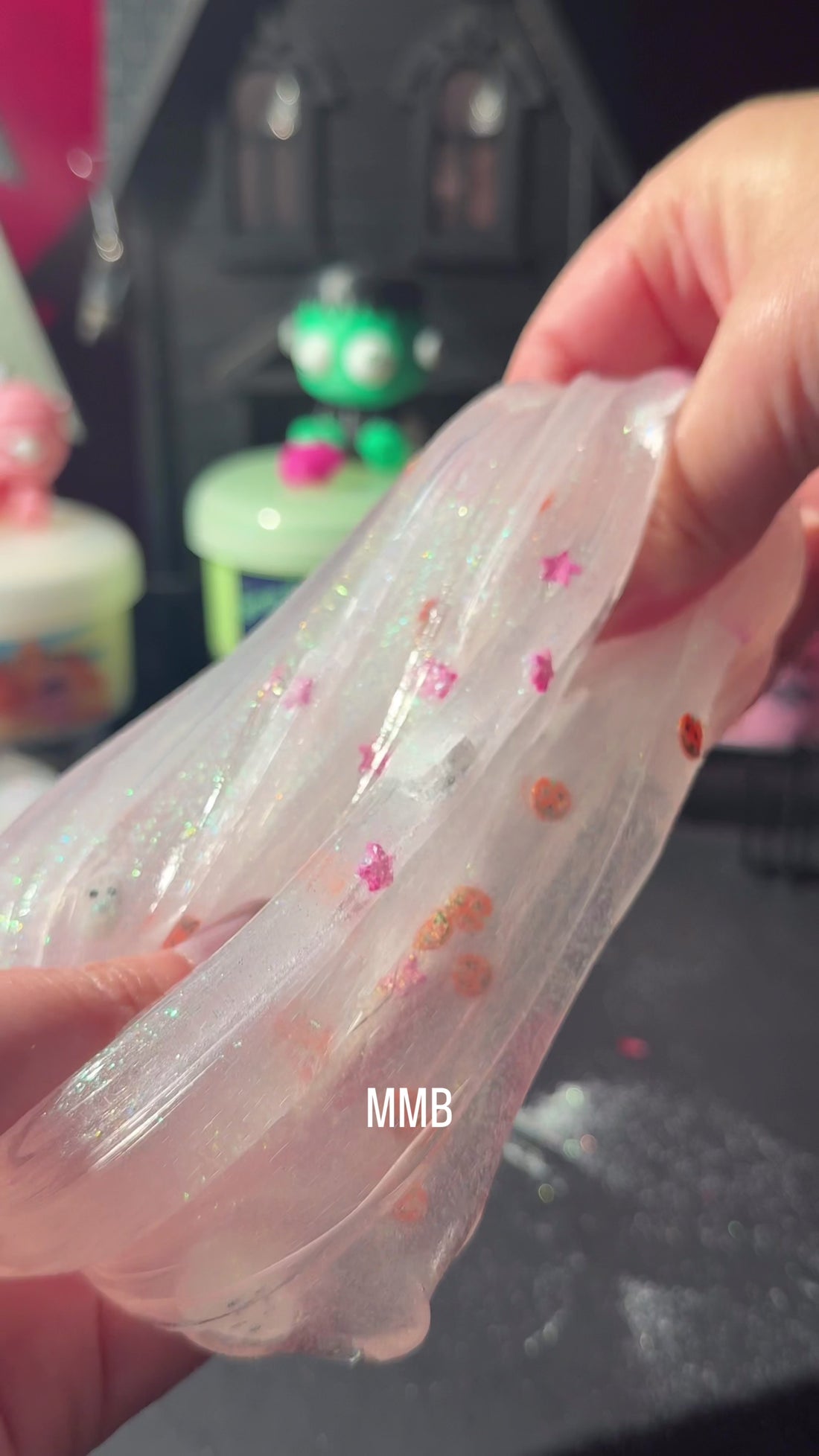 Boo-som Buddies glow in the dark clear slime with two 3D printed ghost charms, glitter, and pumpkin fimo mix
