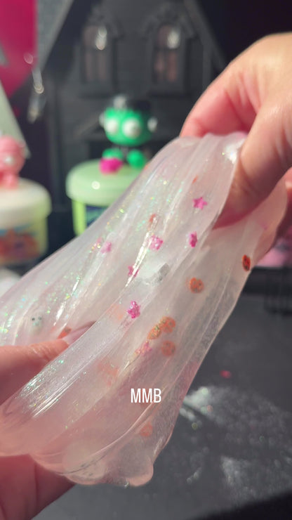 Boo-som Buddies glow in the dark clear slime with two 3D printed ghost charms, glitter, and pumpkin fimo mix